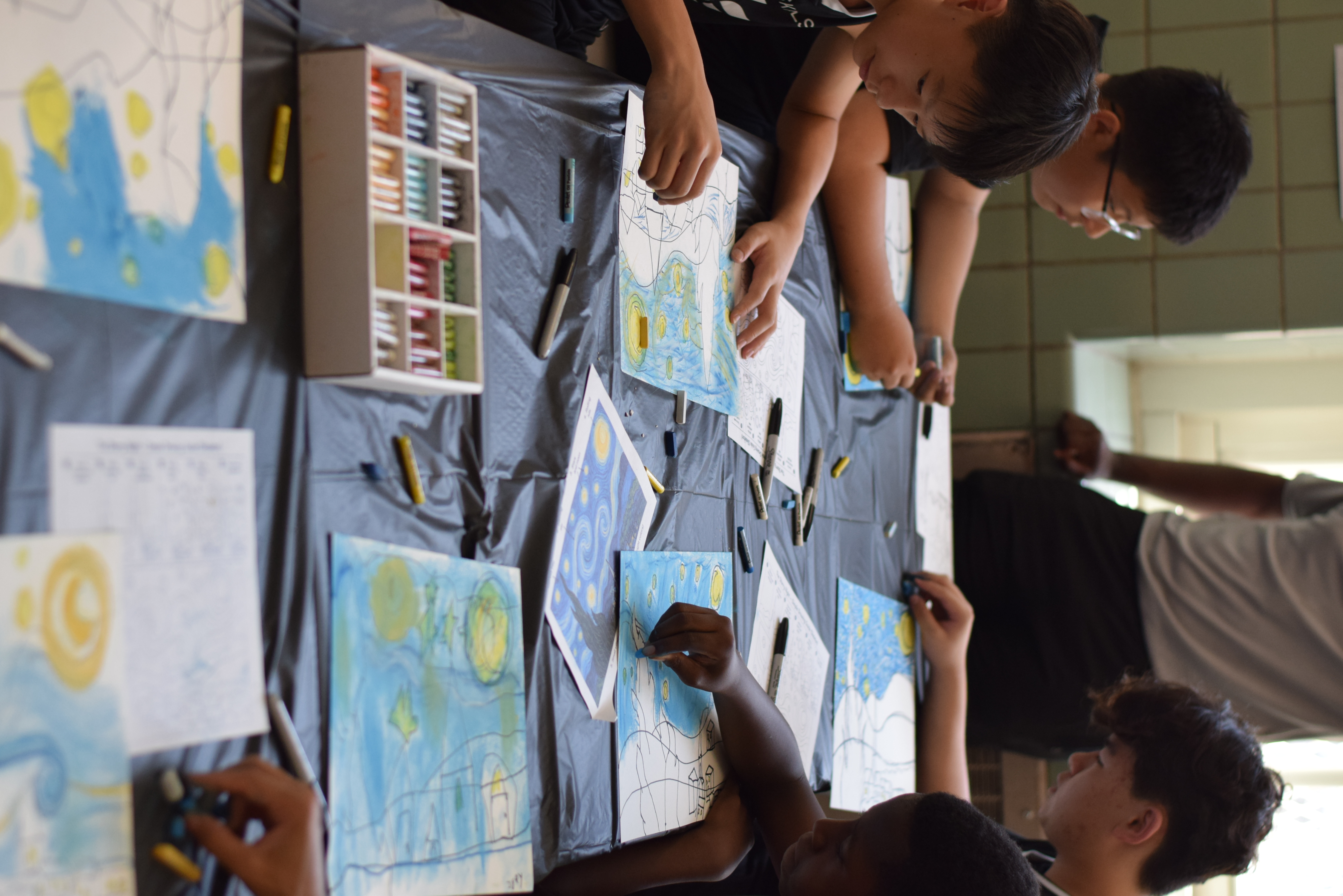 Kids working on art projects at an Elite Skills art party