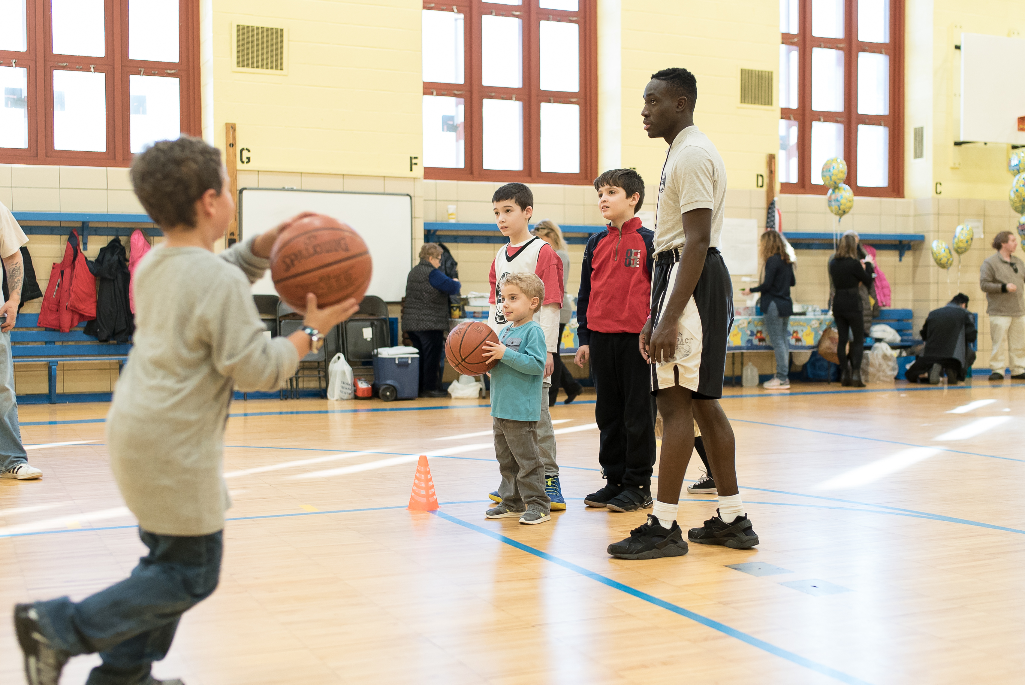 Kids playing basketball at a party