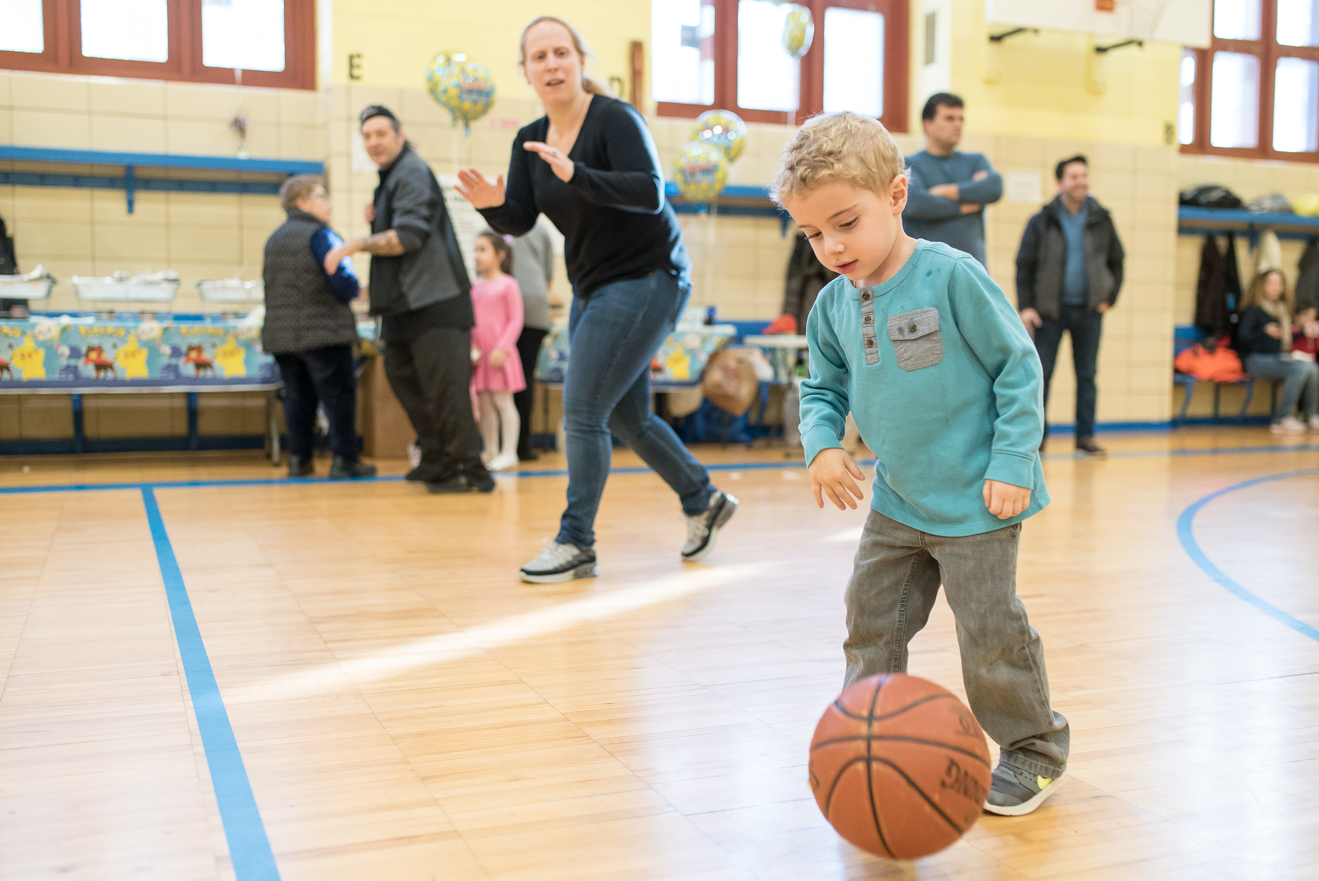 Coach running a basketball game at a party