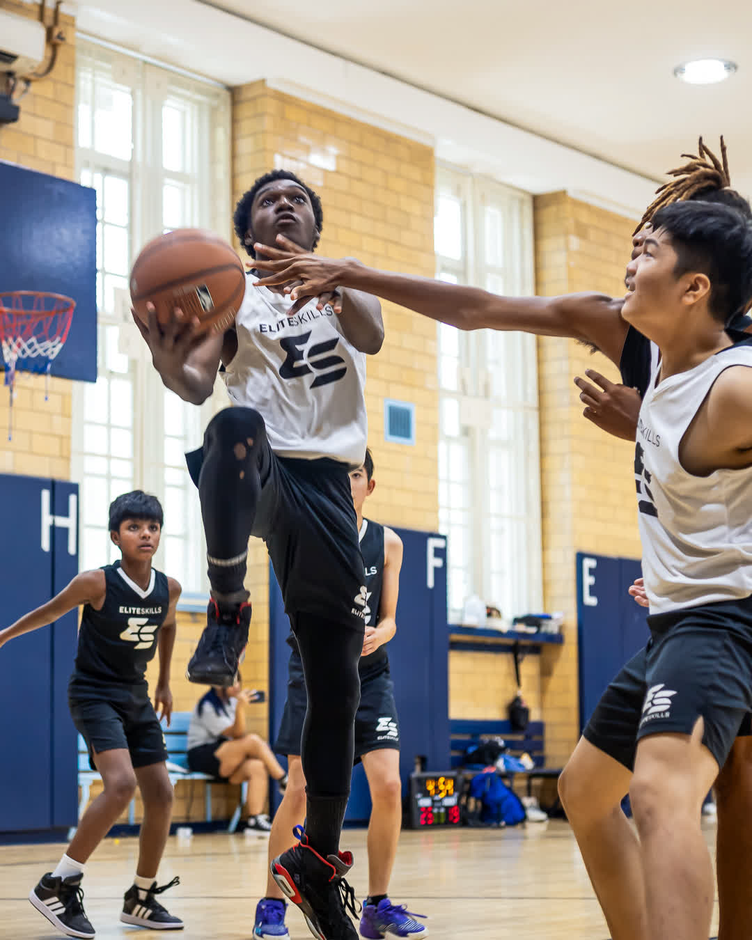 Driving to the basket at summer camp